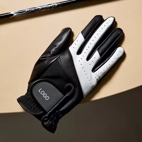 Black and white leather glove with LOGO disc on the closure
