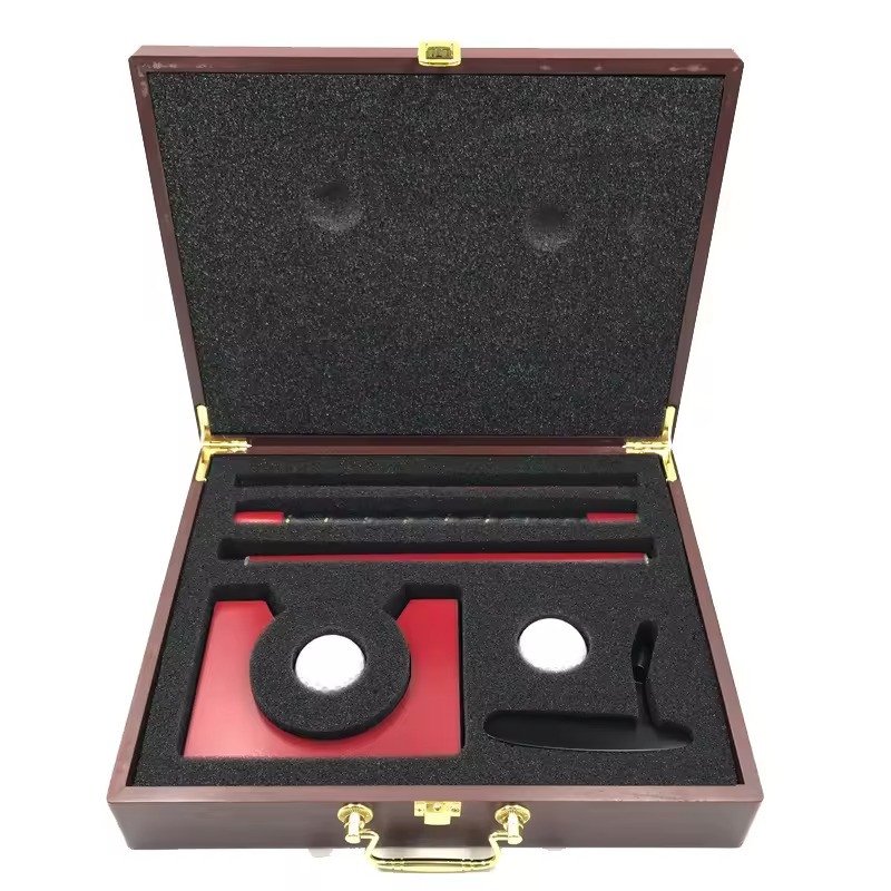 Putter gift set presented in a wooden box with red felt lining
