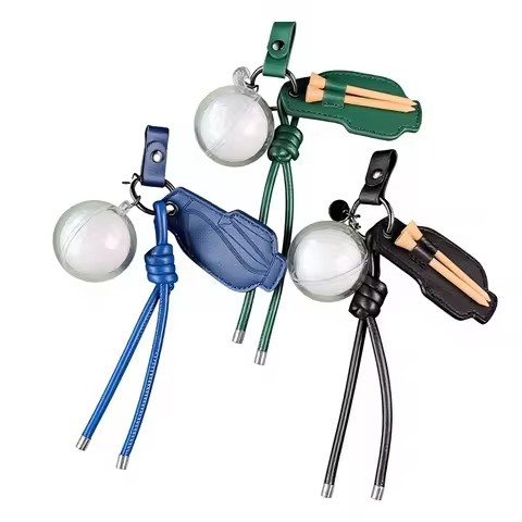 Mini golf-bag keychains holding a ball and tees, four colours