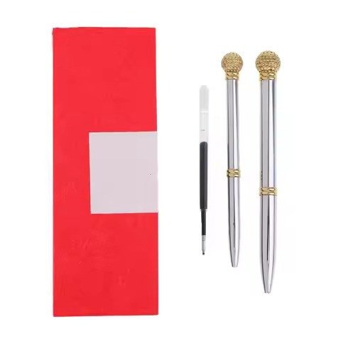 Two golf-ball-top pens with refill and red pouch