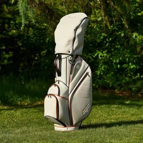 Beige leather-look cart bag standing on turf