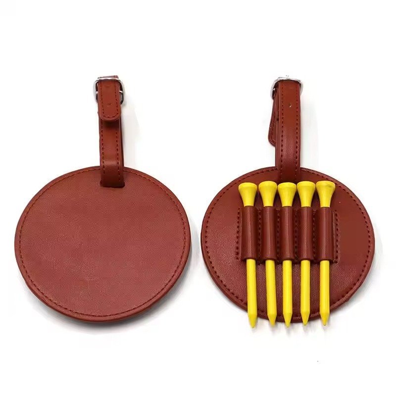 Round leather bag tags, one fitted with five tees