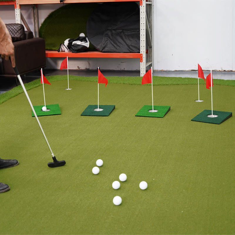Five-station indoor putting setup with practice balls